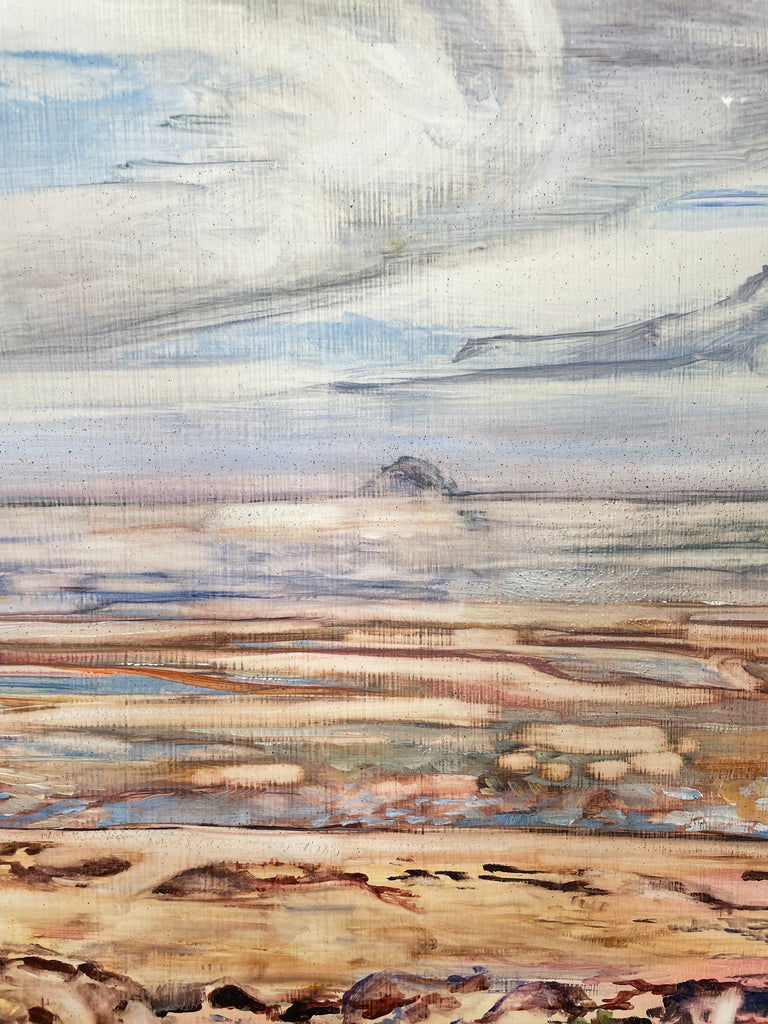 A landscape painting depicting a coastal scene with a cloudy sky, calm water, and a sandy shoreline in muted tones of blue, beige, brown, and gray.